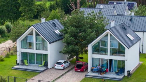 an aerial view of a house with a garage at Szklane Domy ! in Junoszyno