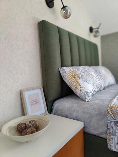 a room with a bed and a bowl on a table at Miro guesthouse in Tivat