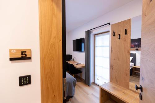an open door to a room with a desk and a room with a desk at Boutique Hotel Vila Loka in Škofja Loka