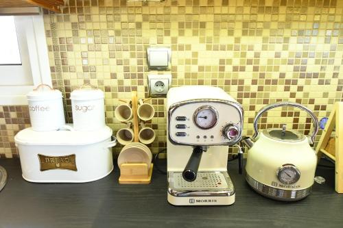 a group of appliances sitting on top of a counter at Nefelifamilyhouse with jacuzzi in Lagonissi