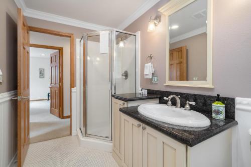 a bathroom with a sink and a shower at Sandpiper Beach House in Cannon Beach