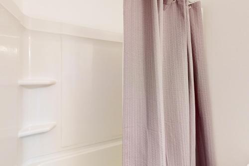 a shower curtain is hanging in a bathroom at Town of Dewey Beach --- 6 Jersey Street in Dewey Beach