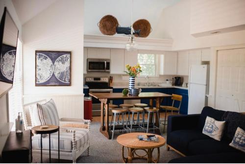 a living room with a couch and a table with chairs at Chapman House in Put-in-Bay