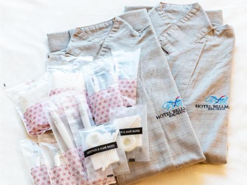 a pile of products sitting on a table at Hotel BELLMARE ホテルベルマーレ in Maizuru