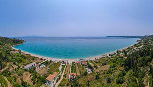 an aerial view of a beach and the ocean at Diona Studios in Lourdhata