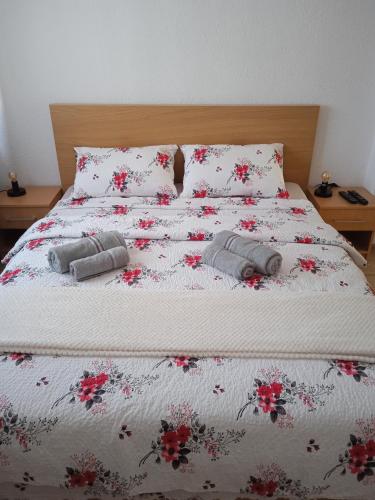 a bed with two pillows on top of it at Nice view-Plitvice in Korenica