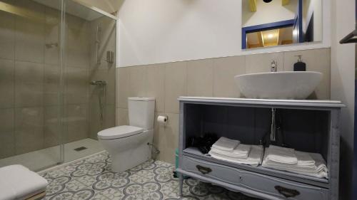 a bathroom with a sink and a toilet and a shower at Quinta Ecológica da Peneda Agroturismo by Peneda ecofarm in Arcos de Valdevez