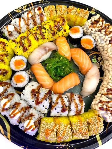 a plate of sushi and vegetables on a plate at Hotel Sangro in Mozzagrogna