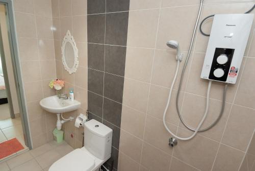 a bathroom with a shower with a toilet and a sink at Ipoh Town P Kepayang in Ipoh