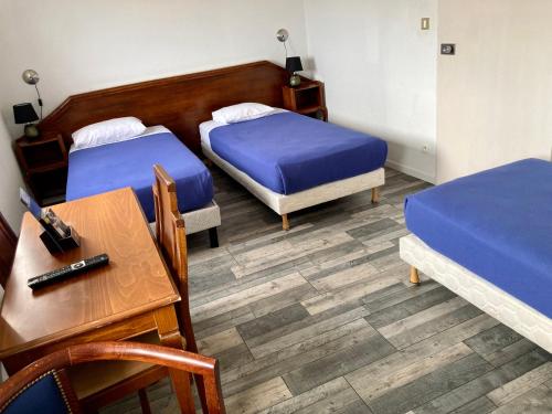 Ένα ή περισσότερα κρεβάτια σε δωμάτιο στο Hôtel De Champagne