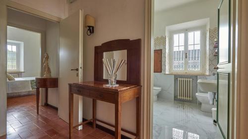 a bathroom with a sink and a mirror at Podere San Carlo in Siena