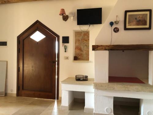Μια τηλεόραση ή/και κέντρο ψυχαγωγίας στο Trullo Totoli Gallipoli Salento