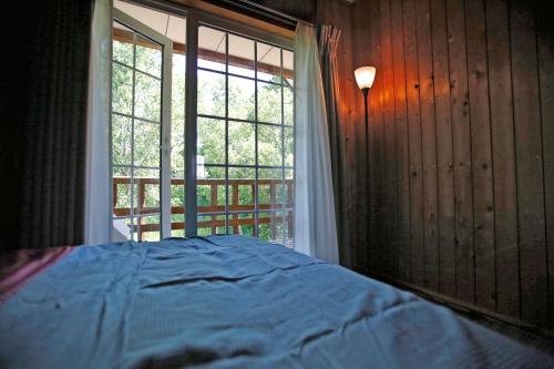 Postel nebo postele na pokoji v ubytování The LODGE ABASHIRI