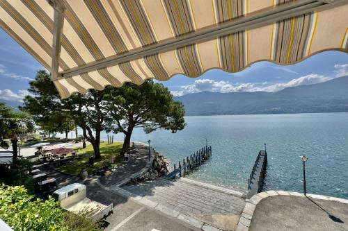 a view of a body of water from a building at Casa al Lago Apartments - Brissago Experience in Brissago