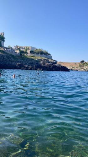 a person swimming in a body of water at A Casa di Lu in Minervino di Lecce
