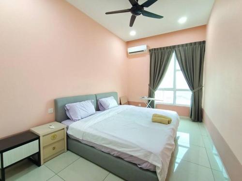 a bedroom with a bed and a ceiling fan at Johor Bahru Luxury Pinnacle Tower 3 Bed 2 Bath in Johor Bahru