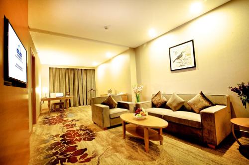 Coin salon dans l'établissement Ramada by Wyndham Beijing Airport
