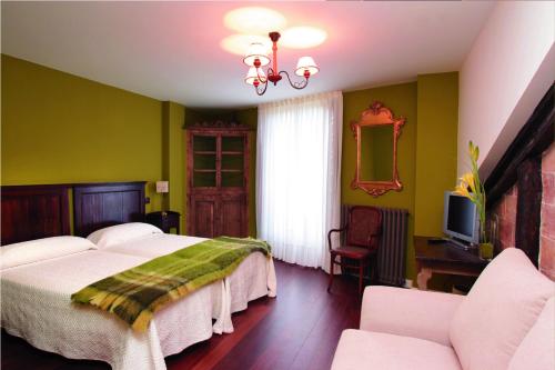 A bed or beds in a room at La Casona del Pastor