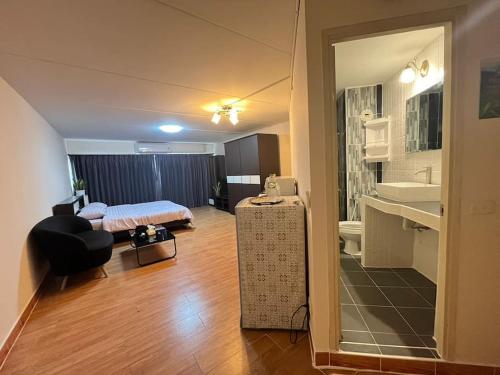 a small room with a bed and a bathroom at T12 Popular Condo By : hunnity in Ban Bang Phang