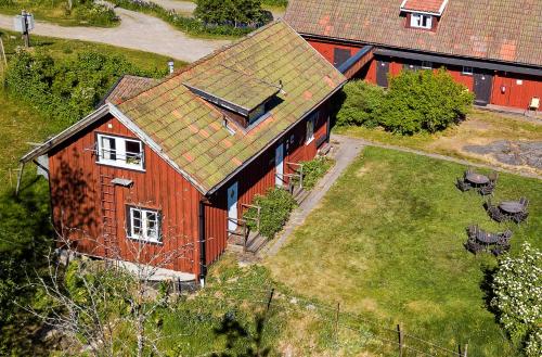 an overhead view of a red house with a yard at STF Tivedstorp in Tivedstorp