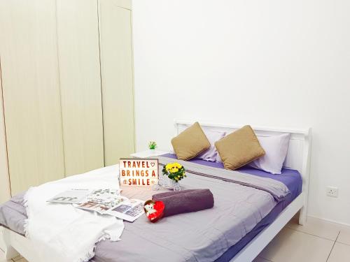 a bed with a sign that reads things is always a smile at Medini Elysia Park , 3 min to Legoland, Netflix By Hint Homestay in Nusajaya