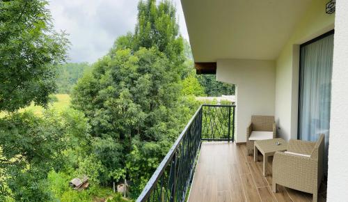 a balcony with a view of a tree at Ilidža Park Apartments in Sarajevo
