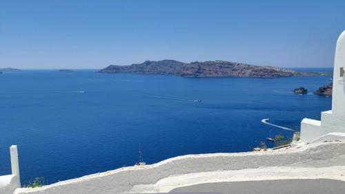 a view of a large body of blue water at Olympic Villas in Oia