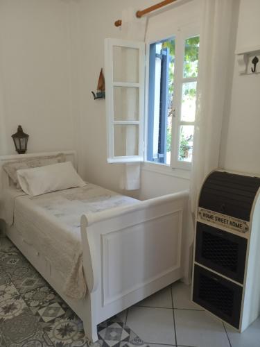 Postel nebo postele na pokoji v ubytování Giaglakis Rooms