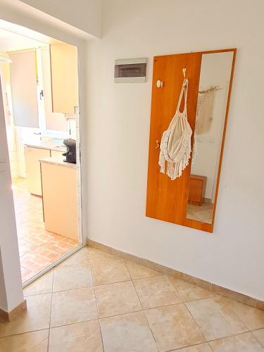 a living room with a painting on the wall at Natua Apartment in Krvavica