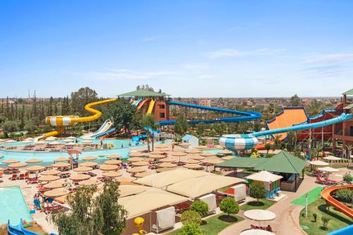 an image of a water park with slides and umbrellas at Pickalbatros Aqua Fun Club All Inclusive in Marrakech