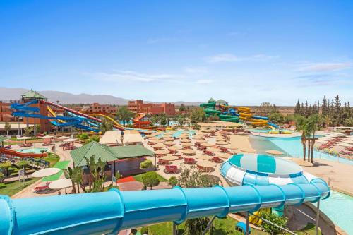 a water park with a pool and a water slide at Pickalbatros Aqua Fun Club All Inclusive in Marrakech