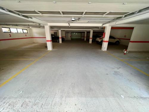 an empty parking garage with a car parked in it at Apartmani SLEEP&JOY in Zlatibor