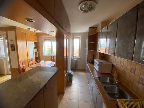 a kitchen with a sink and a counter top at Family Apartment in City Centre in Bitola
