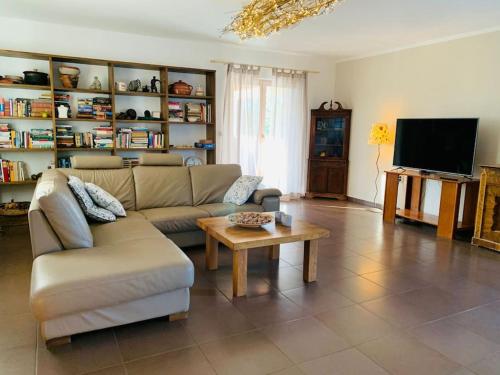 a living room with a couch and a coffee table at Grant's in Labin