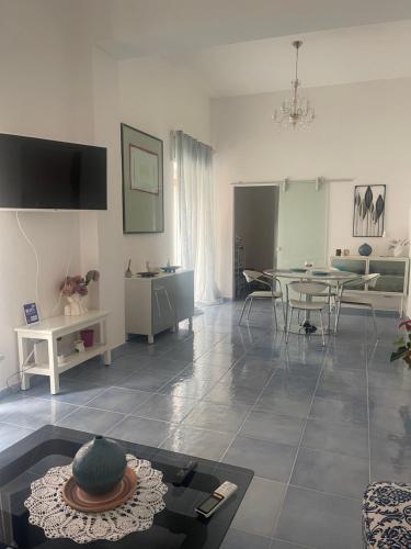 a living room with a table and a dining room at Acquamarina in Agropoli