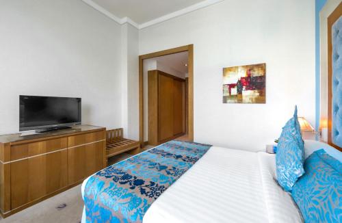 Ein Bett oder Betten in einem Zimmer der Unterkunft Marina Byblos Hotel