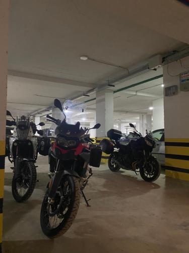 a group of motorcycles parked in a parking garage at Blue Apartments & Hotel Shengjin in Shëngjin