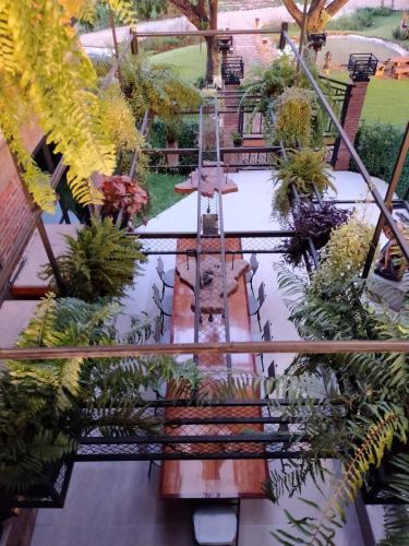 an overhead view of a garden with a bench and plants at SuanGlangNa in Phrae