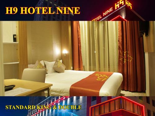 a hotel room with a bed and a sign that says hoteline at H9 Hotel Nine Ulaanbaatar in Ulaanbaatar