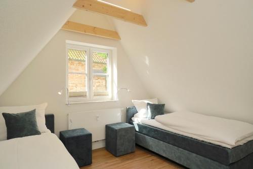 Ένα ή περισσότερα κρεβάτια σε δωμάτιο στο Ferienhaus am Schleswiger Dom Lütt Huus