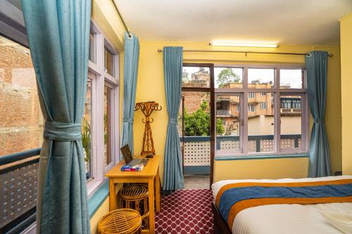 Postel nebo postele na pokoji v ubytování Kwabahal Boutique Hostel