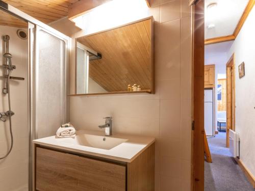 a bathroom with a sink and a mirror at Appartement confortable avec garage et wifi dans secteur calme à Val-d'Isère - FR-1-694-154 in Val dʼIsère
