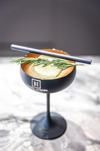 a bowl of food with two chopsticks on a table at HOTEL EUROPA in Komárno