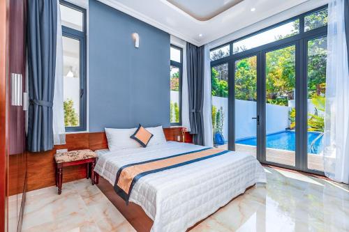 Postel nebo postele na pokoji v ubytování Blue Sea Villa Vũng Tàu 2