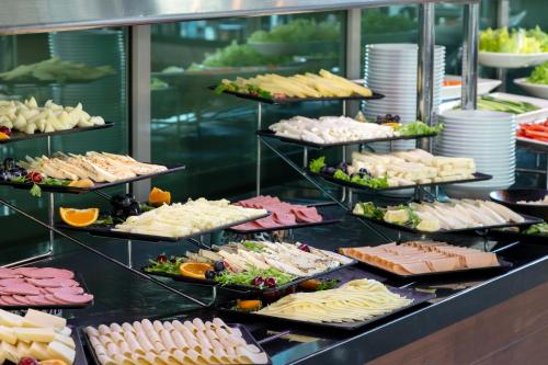 a buffet line with many different types of food at Miracle Istanbul Asia Airport Hotel & Spa in Istanbul