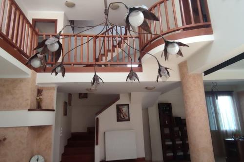a room with a staircase with a bunch of lights at Villa Demy in Patra