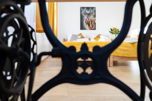 a bedroom with a bed with a yellow blanket at Dom Krawca - pod Chojnikiem in Jelenia Góra