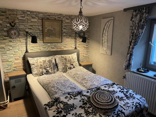 Postel nebo postele na pokoji v ubytování B&B De Eifelhoeve