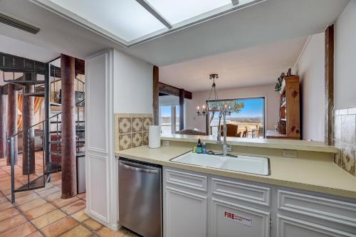 a kitchen with a sink and a dishwasher at Perched Above the River in Lago Vista