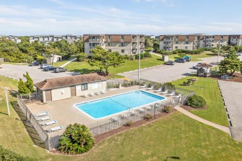 an overhead view of a swimming pool in a park at Southwinds, Unit H13 in Atlantic Beach